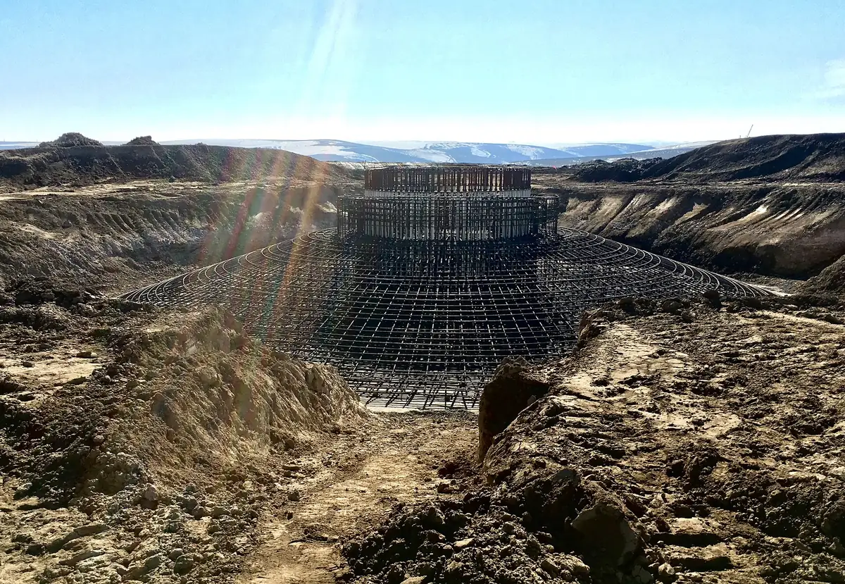 Rebar cage for a wind turbine foundation in an excavated pit